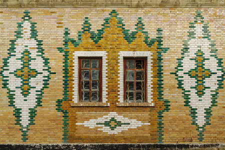 The facade of an old building is faced with glazed bricks. Steppe Zeikhgauz. The picture was taken...