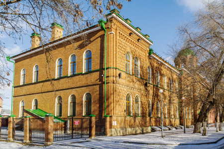Orenburg, Russia - September, 14, 2020: Corner of an old brick building with a dome of the house church. Gymnasium number 2 on Brykina streetのeditorial素材