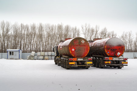 Orenburg, Russia - December, 16, 2019: Oil trucks in a parking lot, in winter in snowfallのeditorial素材
