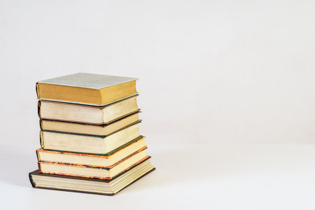 Stack of old books on white backgroundの写真素材