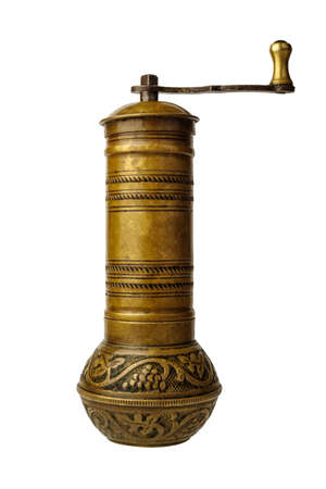 Antique manual bronze coffee grinder. Isolated on white backgroundの写真素材