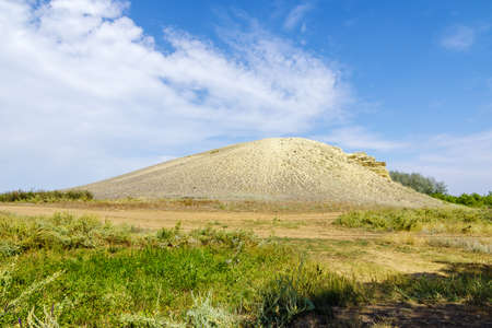 Sandy-rocky hill in the steppe. Snake Mountain, natural landmark. Sol-Iletsk district of the Orenburg region, Russiaの写真素材