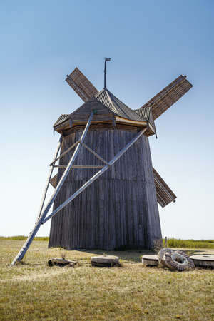 Old wooden windmill and old millstones. Chelyabinsk region, Russiaの写真素材