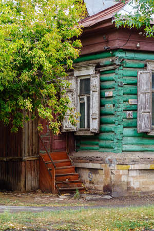 Orenburg, Russia - September, 04, 2021: An old log house with platbands and shutters, and wooden steps. Paris Commune Street 63のeditorial素材