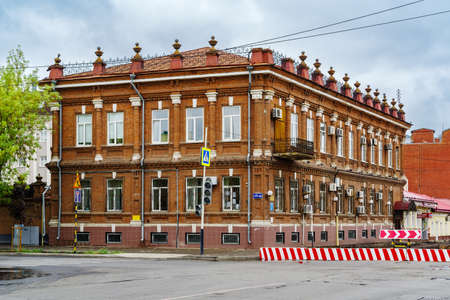 Orenburg, Russia - September, 04, 2021: Old two-story brick house with a basement, at the...
