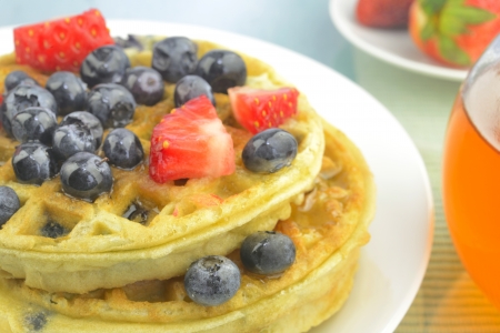 Waffles with blueberries and strawberriesの写真素材