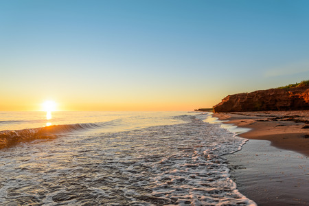 Ocean coast at the sunrise (Thunder Cove, Prince Edward Island, Canada)の写真素材