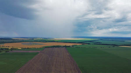Rain falling in the distance from above. atmospheric phenomenon.の写真素材