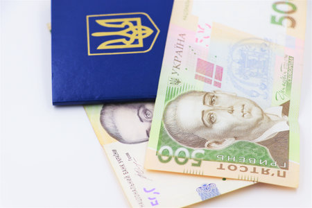 Ukrainian money and passport. economics and citizenship.の写真素材
