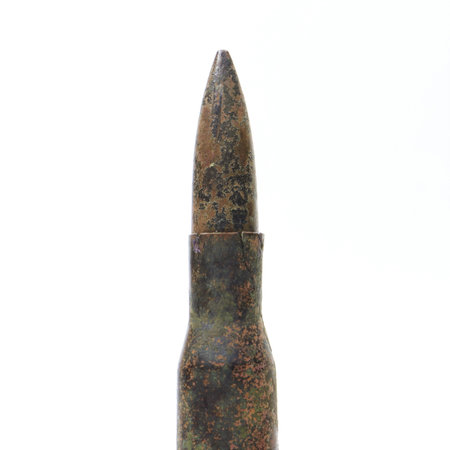 Old rifle cartridge on a white background.の写真素材