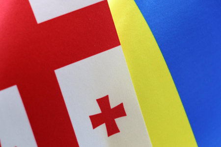 Close-up of the Georgian and Ukrainian flags side by side. A symbol of international unity.の写真素材