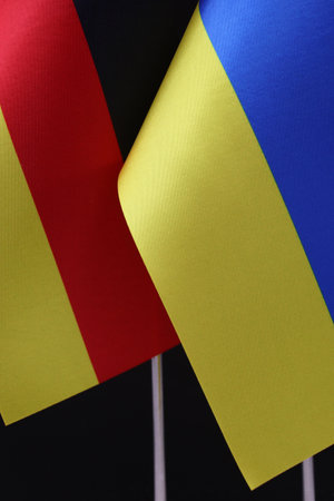 Close-up of the German and Ukrainian flags side by side. A representation of unity.の写真素材