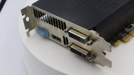 A computer graphics card placed on a white surface.の写真素材