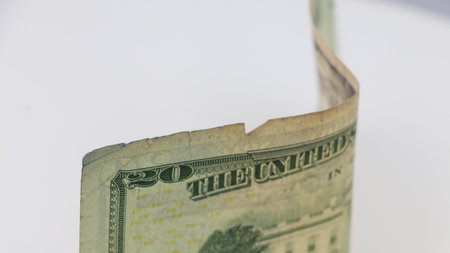 A folded twenty-dollar bill in close-up view.の写真素材