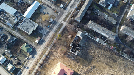 Top-down view of a city street with buildings and intersections.の写真素材