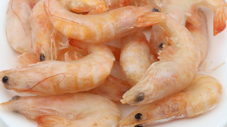A detailed close-up of cooked pink shrimp.の写真素材