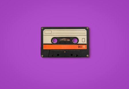 Vintage old audio cassette with magnetic tape twisted out. Retro musicの写真素材