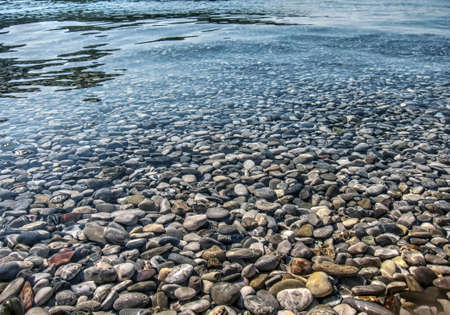 The sea pebbles pattern on a Mediterranean beach.