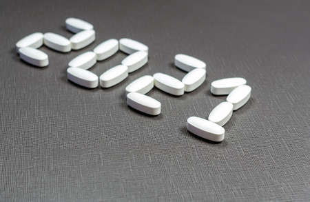A lettering 2021 created by pills on the dark background.