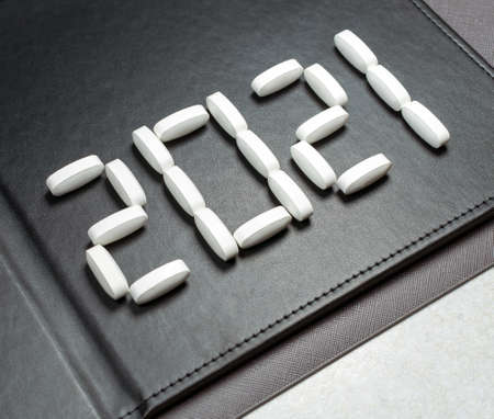A lettering 2021 created by pills on the dark background.