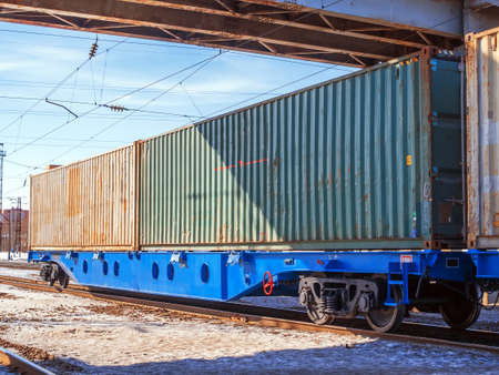 A 80-fts Idler flatcars with a two of intermodal 40-fts long containers on the marshalling yard of Trans-Siberian Railwayの写真素材