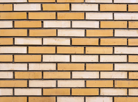 Texture of yellow brick masonry. Background of wall pattern. Close-upの写真素材