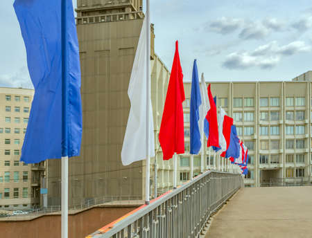 Festive multi color flags in an urban environment. Without people. The street of the town. Outdoors.の写真素材