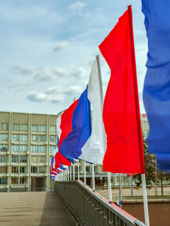Festive multi color flags in an urban environment. Without people. The street of the town. Outdoors.の写真素材