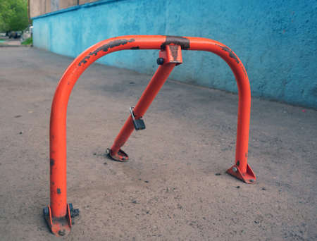 Car parking lock device. Manual car parking barrier with lock and stop sign. Guests parking dedicated. Parking spot saver.の写真素材