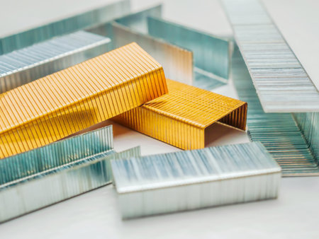 Metal staples for a stapler gun isolated on white background. Close-up, selective focus.の写真素材