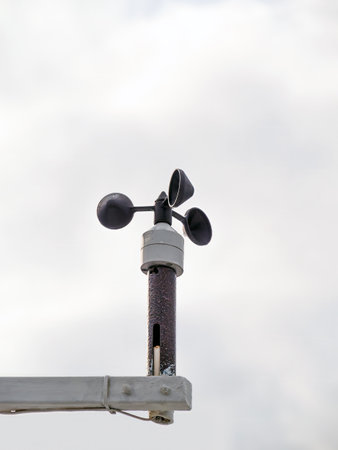 Cup anemometer against cloudy sky.の写真素材