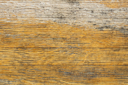 Texture of an old yellow, beige wooden board close up.の写真素材