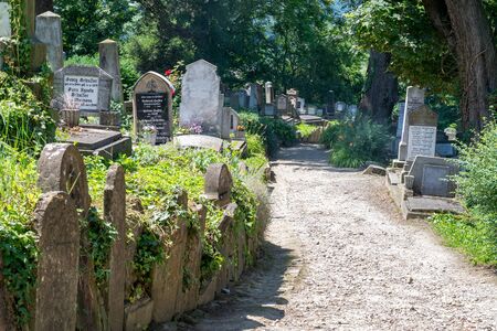 SIGHISOARA, ROMANIA - 1 JULY 2016: Saxon cemetery, located next to the Church on the Hill in Sighisoara, Romania.のeditorial素材