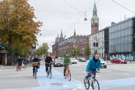 Copenhagen - October 23, 2016: Cyclers passing by  a street in Copenhagen