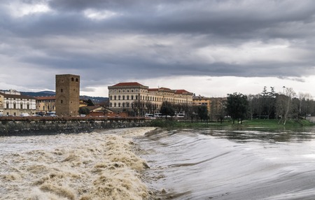 Arno River in Florence, Italy on a cloudy day.のeditorial素材