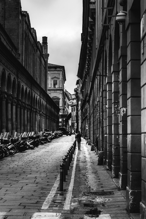 Black and white image of a street in Bologna, Italy.のeditorial素材