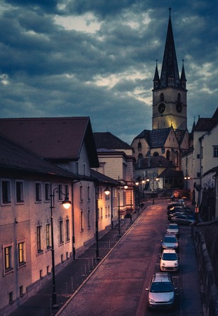 Beautiful medieval architecture with the Evangelical Church in background in Sibiu, Romania.のeditorial素材