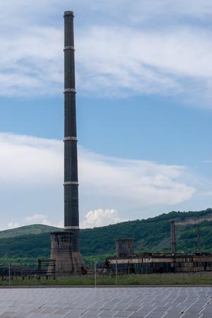 Power plant and solar panels in the middle of a field in Transylvania, Romaniaの写真素材