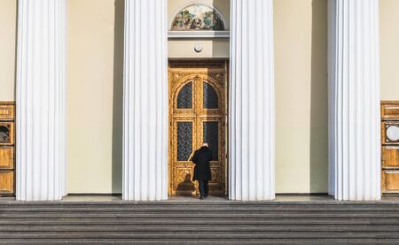 CHISINAU, MOLDOVA - 5 FEBRUARY, 2016: An unidentified man entering the chisinau cathedral in ce center of the city of Chisinau, Moldova.のeditorial素材