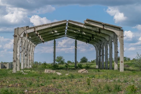 A former soviet building in ruins in an abandoned field.の写真素材