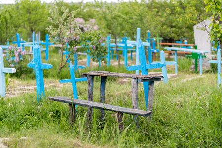 A view to a cemetery with blue crosses.の写真素材