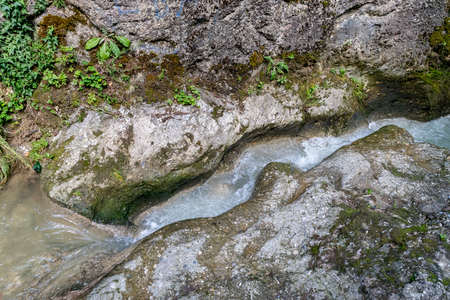 Small mountain river flow throught rocks.の写真素材