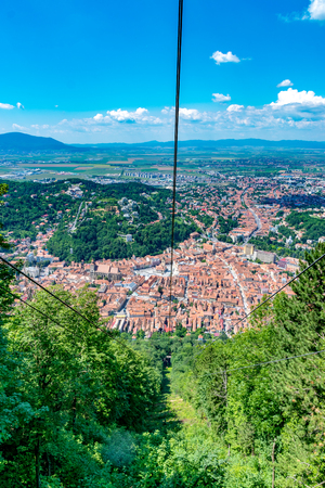 Brasov city viewed from the cable car leading to Tampa Mountain in Brasov, Romania.の写真素材