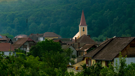 A church in a small village in Transylvania region, Romania.の写真素材