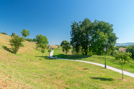 Beautiful park on a sunny day inside Alba-Iulia Citadel, Romania.の写真素材
