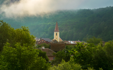 A church in a small village in Transylvania region, Romania.の写真素材