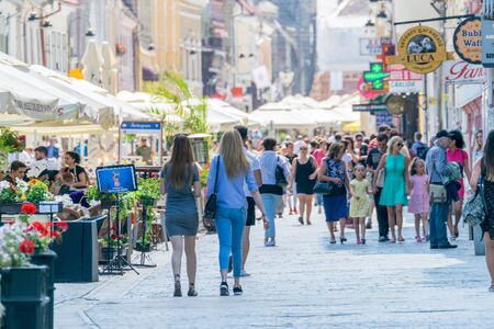 BRASOV, ROMANIA - 19 JUNE, 2018: People walking on a pedestrian street in Brasov, Romania.のeditorial素材