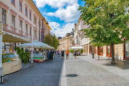 SIBIU, ROMANIA - July 21, 2018: Sibiu, Romania - Nicolae Balcescu beautiful pedestrian street on a sunny summer day with blue sky in Sibiu, Romania.のeditorial素材