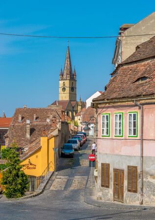 Sibiu, Romania - Beautiful street with Lutheran Cathedral of Saint Mary on a sunny summer day in Sibiu, Romania.のeditorial素材