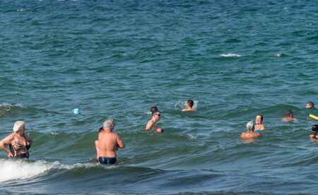 SUNNY BEACH, BULGARIA - 2 SEP 2018: People in the sea at Sunny Beach resort on a sunny day in Bulgaria s Black Sea coast known for its water sports, sand dunes, and nightlife.のeditorial素材